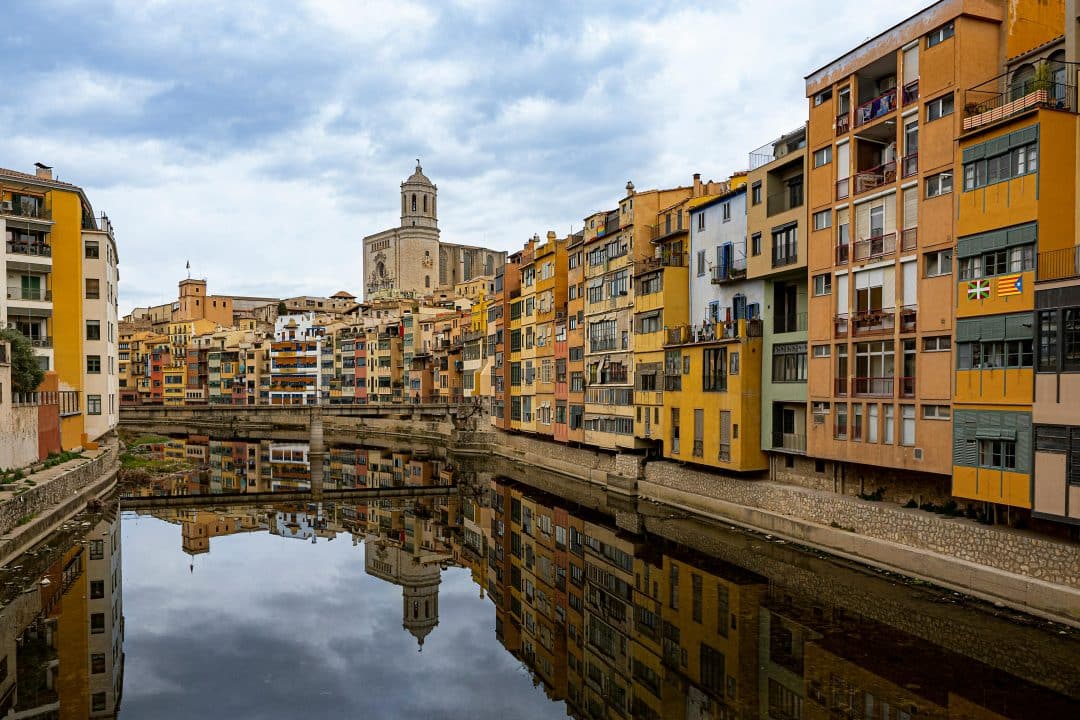 Colourful houses on the Onyar river and Girona Cathedral